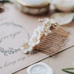 The Beach Brown suite. Here you can see a stunning bridal hair accessory, with white and gold flowers.