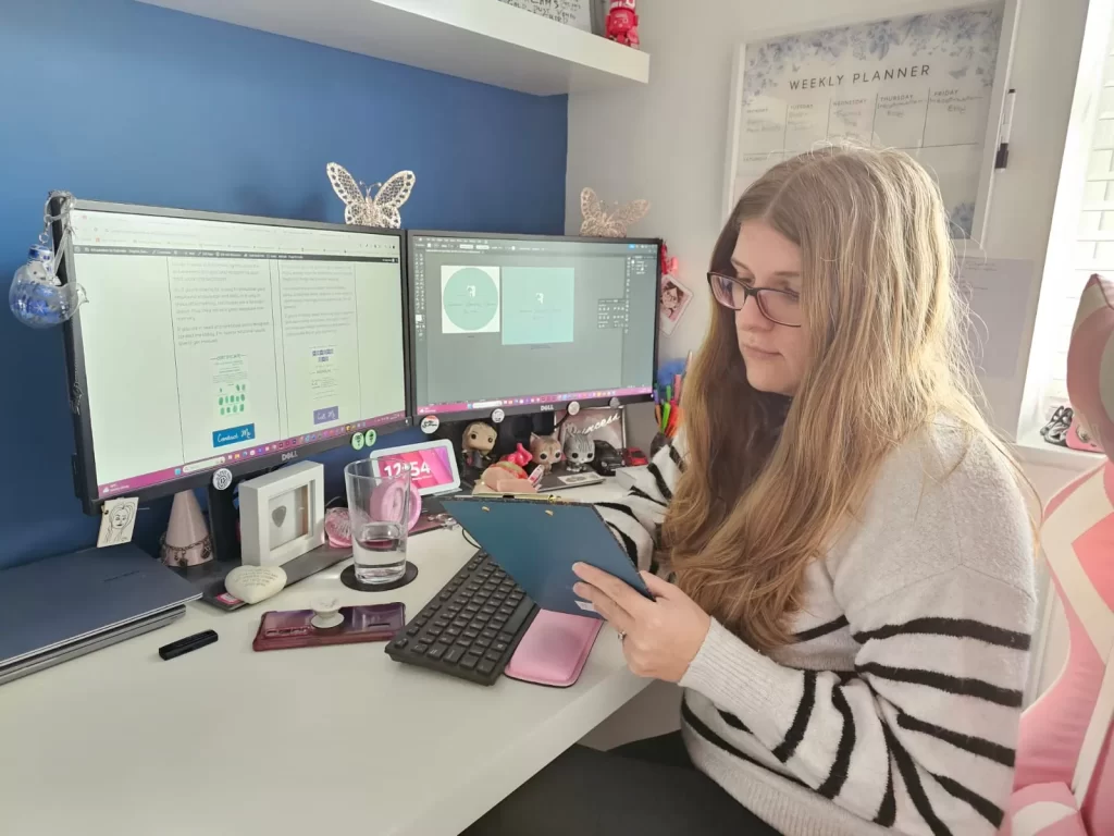 Gabrielle sat at desk